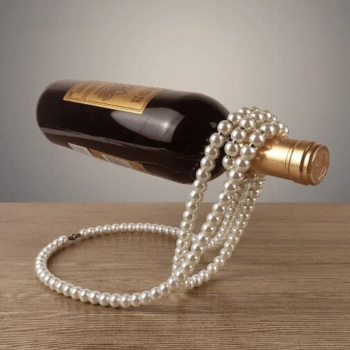 Botellero flotante con collar de perlas